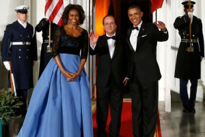 Obama and his wife Michelle greet Hollande as he arrives for a State Dinner in his honor at the White House in Washington